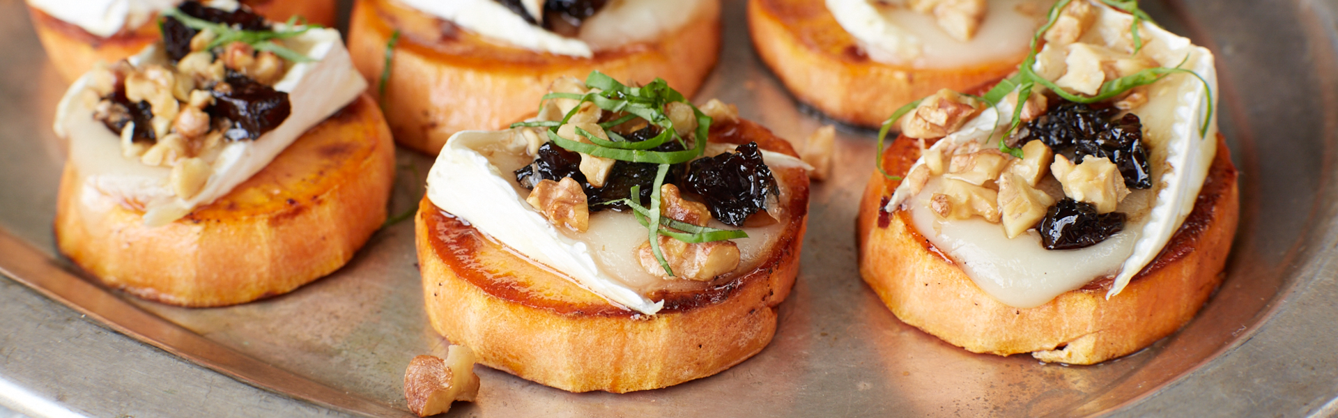 Use sweet potato slices instead of bread for a gluten-free crostini topped with brie and Sunsweet prunes that everyone will love.