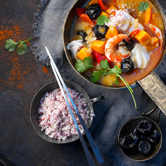 Full of color and flavor, this Southeast Asian fish curry is an unexpected twist on a classic curry. Tamarind is a typical seasoning ingredient in fish curries because it delivers bright flavor. While sweeter, the tanginess of prunes can achieve a similar effect. For a variation, try soaking prunes in lime juice before adding them to the curry.