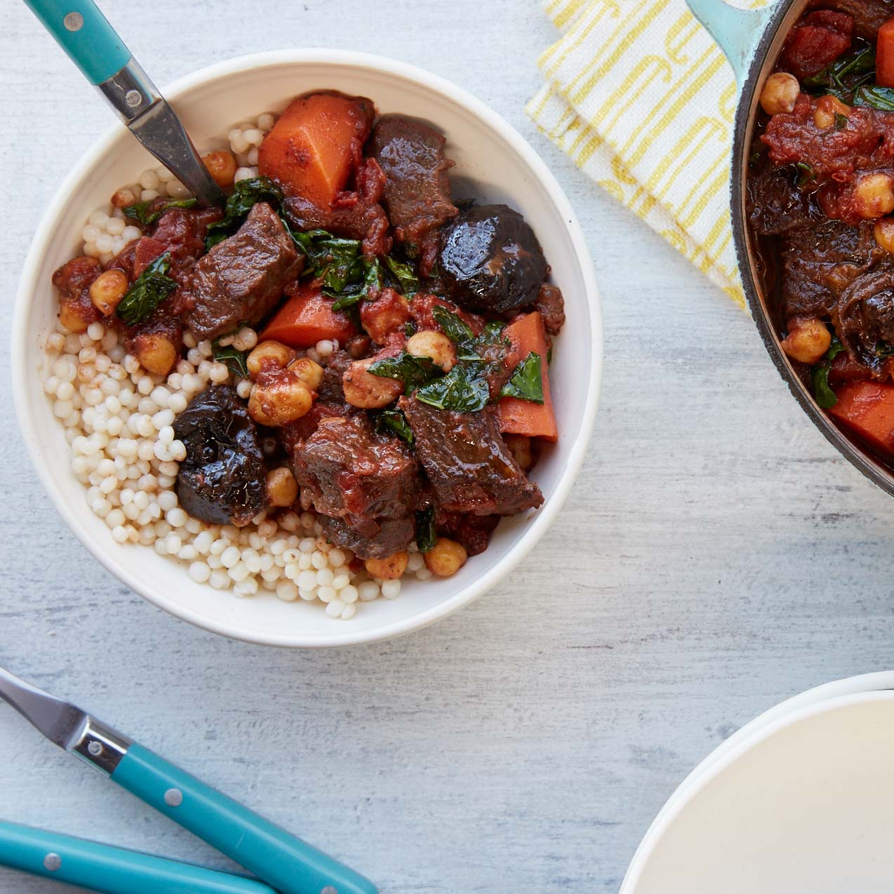 <p>Dried Plums, garam masala, and cinnamon add spice  to beef stew while chickpeas and kale balance the richness and make it a complete meal.</p>

