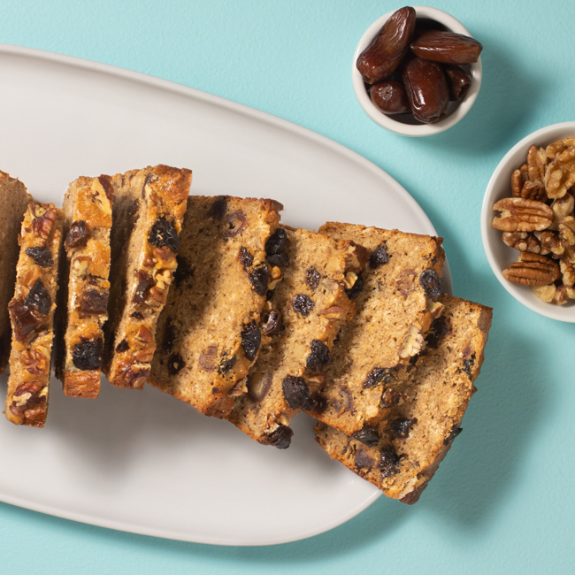 Combining prunes, dates, and nuts together in a spiced quickbread is a way to offer an afternoon pick-me-up that comes with the benefit providing fiber and tangy sweetness from the dried fruit.