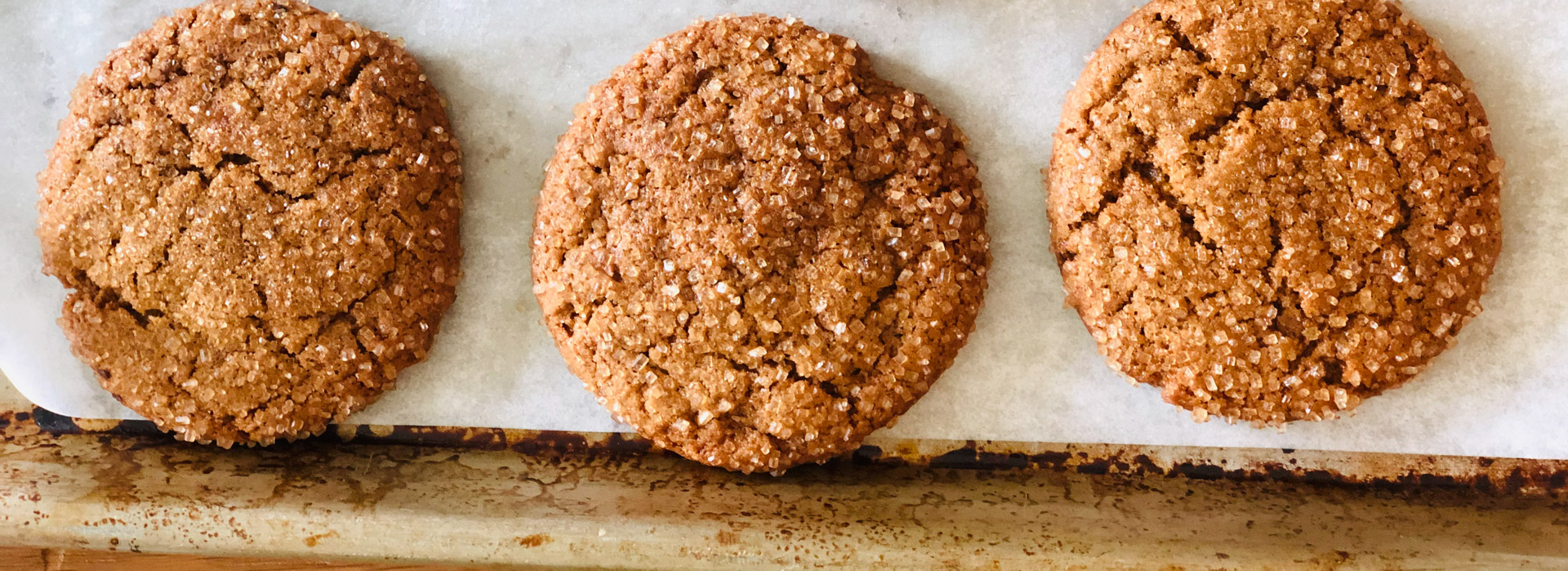 These chewy vegan ginger crinkle cookies are rich, even without butter, eggs, or molasses. Instead, prune puree binds together the ingredients  and adds sweetness with less added sugar.