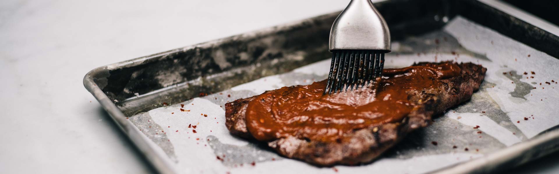 In a classic barbecue sauce, prunes adds depth, deepening the spices while adding sweetness. In this recipe, smoked paprika and ground chipotle peppers adds smokiness in place of liquid smoke.