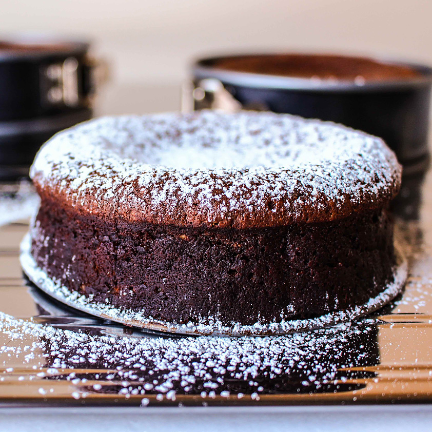 This rich cake leverages a classic dessert pairing: chocolate and hazelnuts,. Here, prune puree deepens the chocolate's decadence.